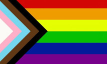 A rectangular flag with six equal-width horizontal stripes: red, orange, yellow, green, blue and purple; a chevron (triangle) on the left side composed of stripes of the following colours (from the left): white, pink, light blue, brown, black